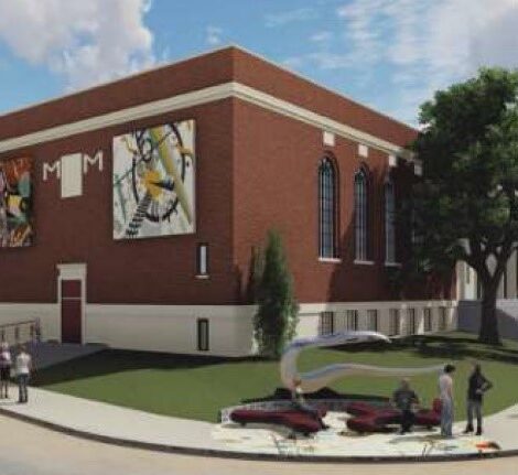 Rendering of a large brick building with 2 large art pieces mounted on the outer wall and sculptures displayed on grass in front